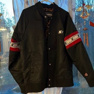 This is a woman’s Starter jacket with leopard on the inside. The size is Large.